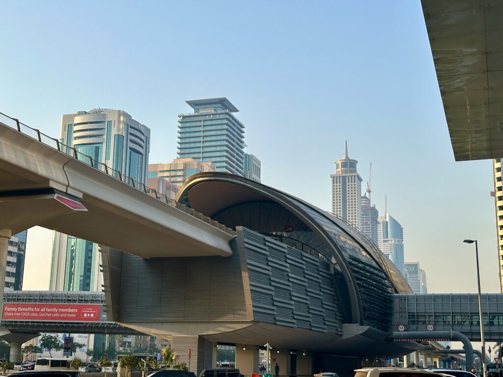 a bridge over a road with a curved roof