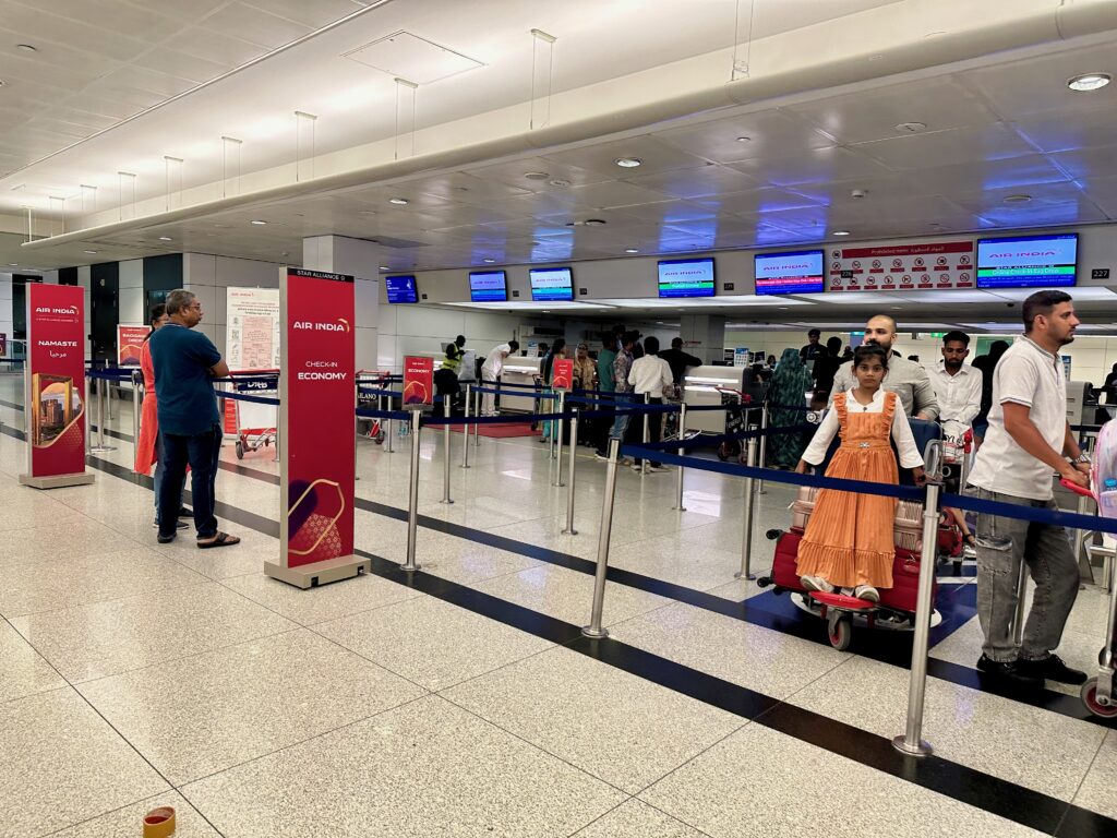 people standing in a line at an airport