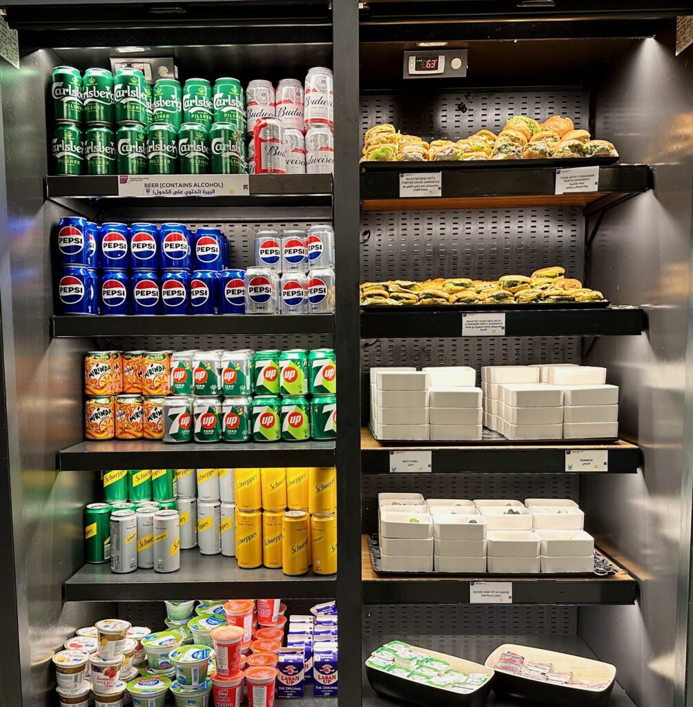 a shelf with cans and cans of soda