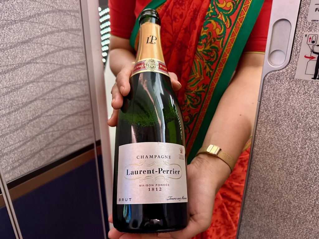 a person holding a bottle of champagne