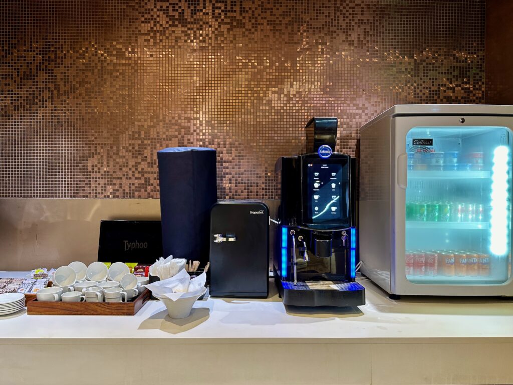 a coffee machine and a refrigerator on a counter