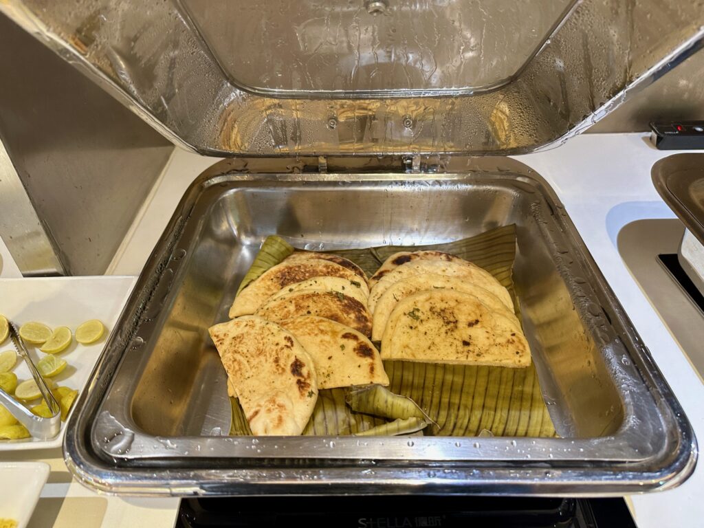 a tray of food in a metal container