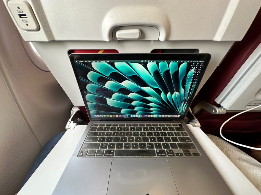 a laptop on a plane