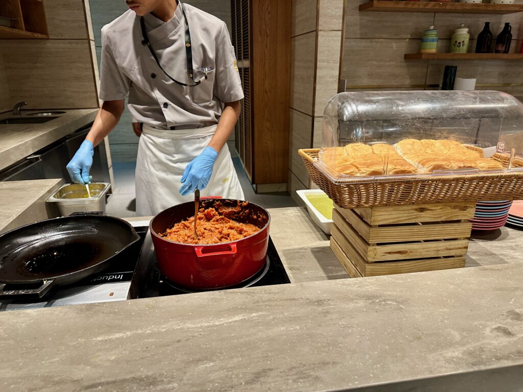 a person cooking food in a kitchen