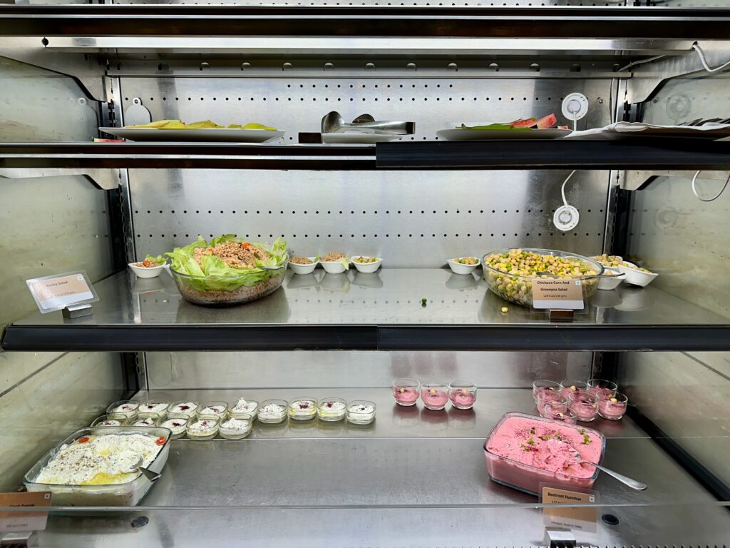 a display case with food on shelves