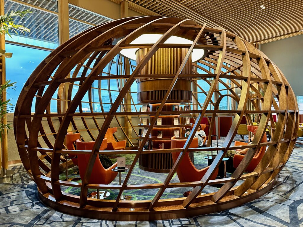 a circular wooden structure with chairs inside