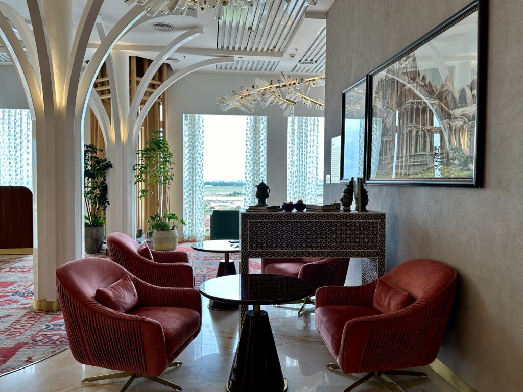 a room with red chairs and a table