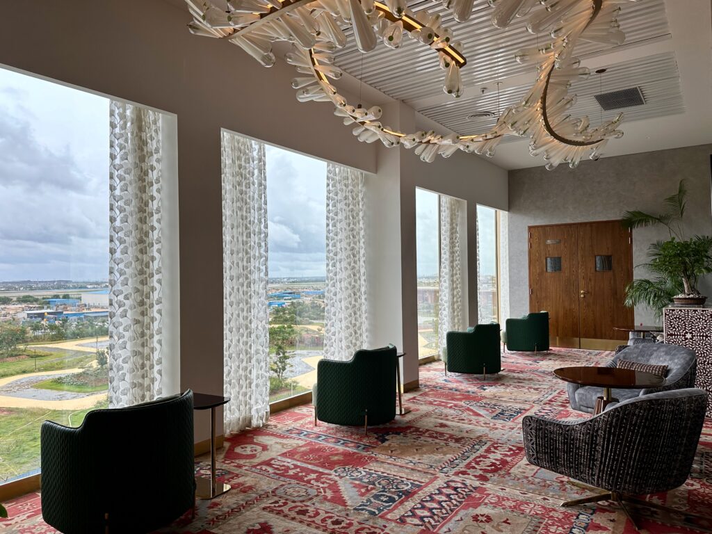 a room with a chandelier and chairs