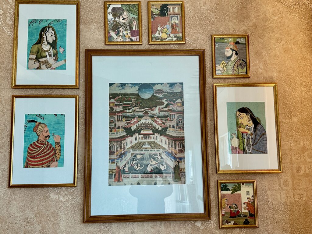 a group of framed pictures on a wall