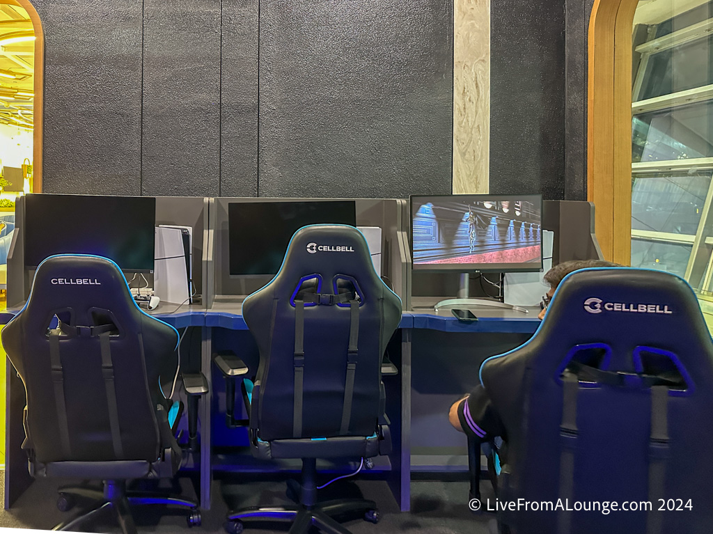 a man sitting in a chair in front of a computer