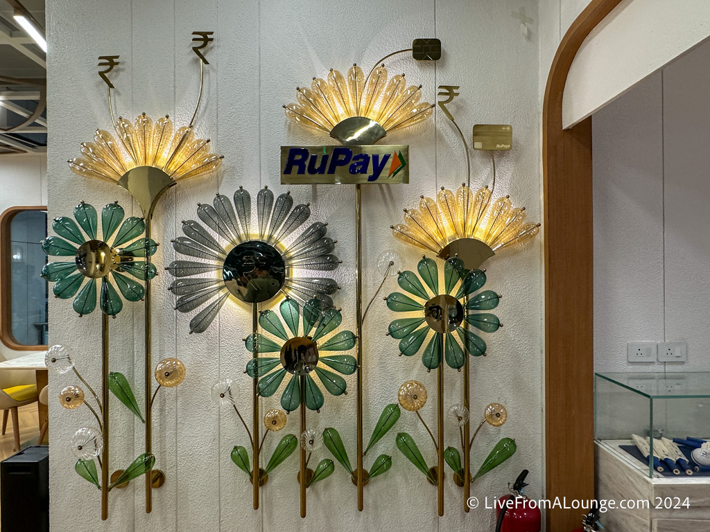 a wall with flowers and lights