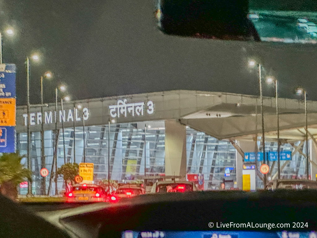 a view from a car window of a building at night