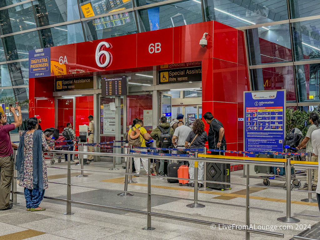 people standing in line at an airport