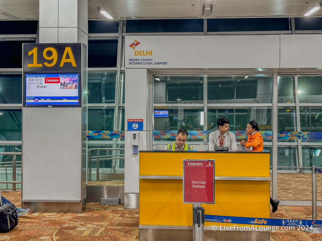 people at a desk in an airport