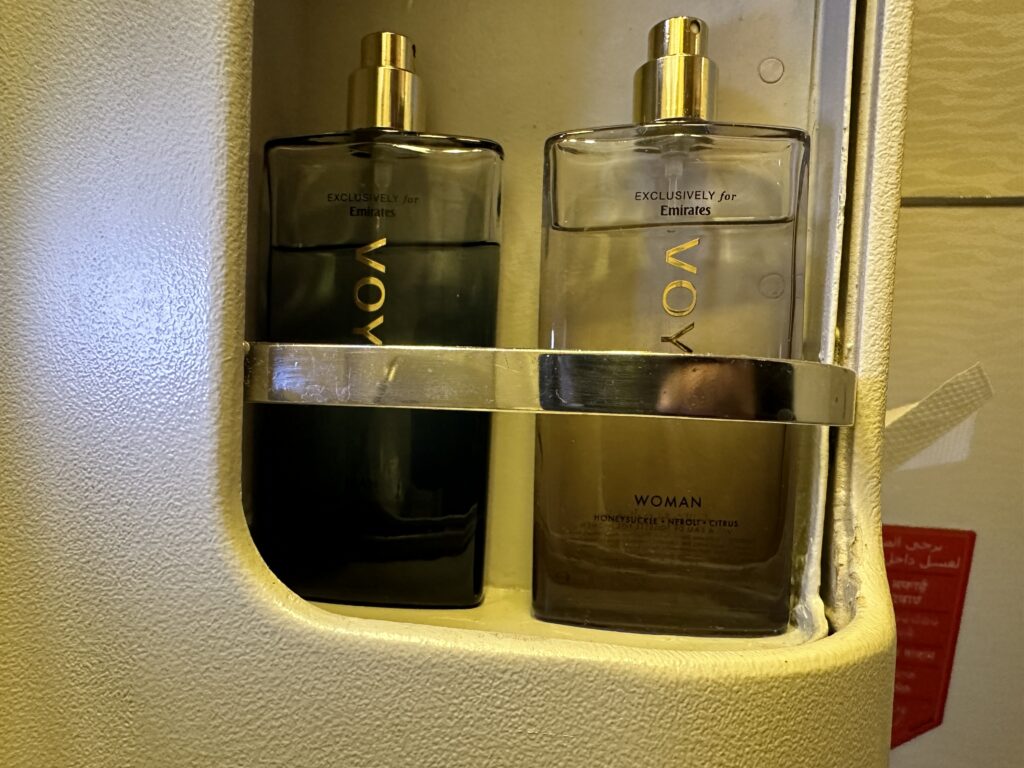 two bottles of perfume in a holder