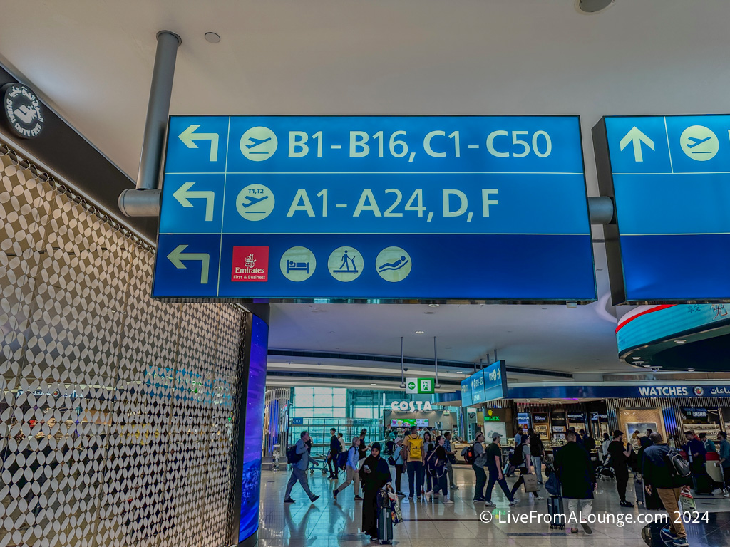 a group of people walking in an airport