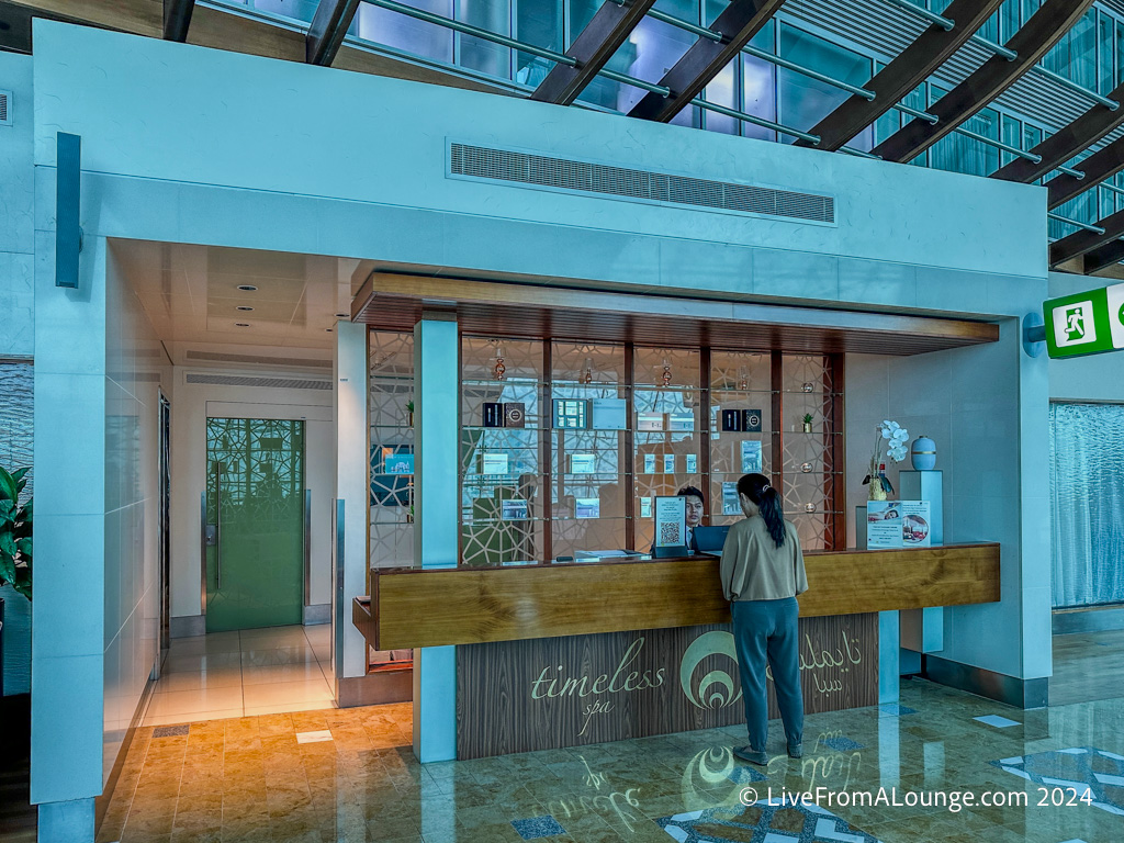 a woman standing at a counter in a building