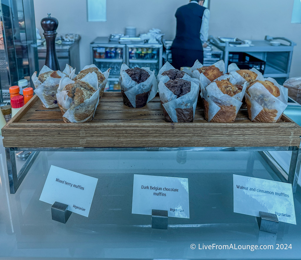 a tray of muffins on a glass shelf