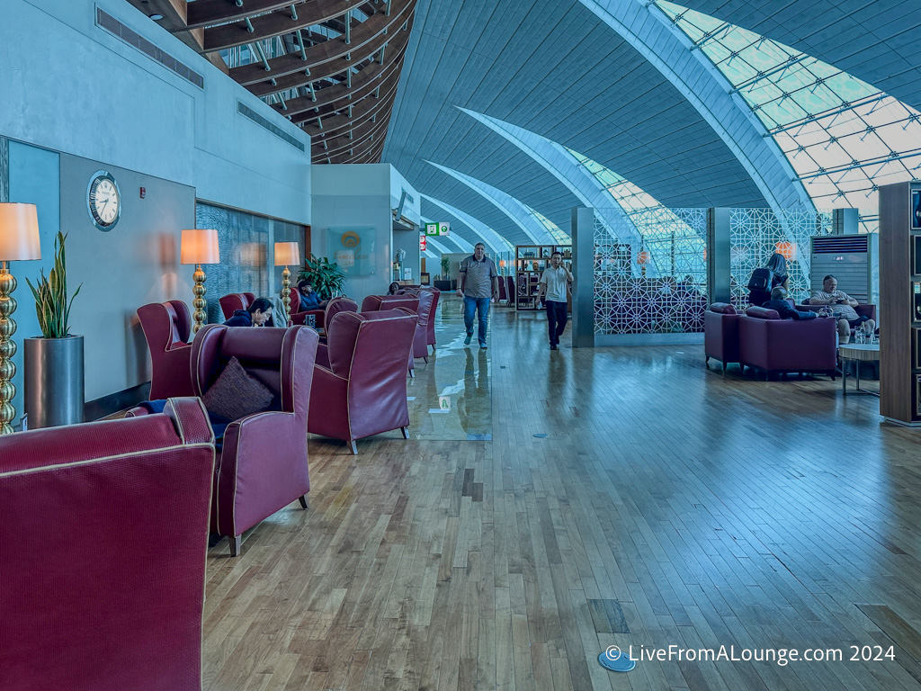 a room with chairs and a large ceiling