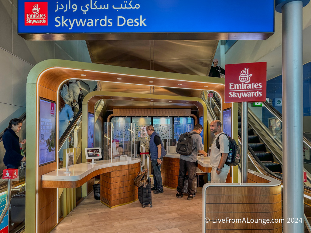 people standing in front of a desk