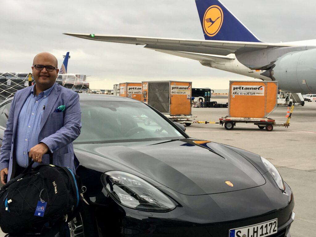 a man standing next to a car