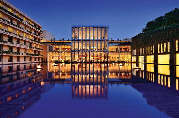 a building with a pool in front of it