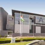 a building with a flagpole in front of it