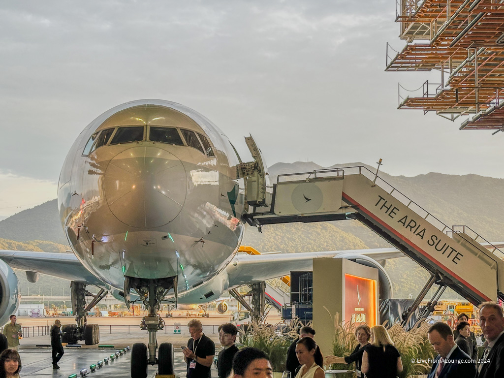 a group of people standing next to an airplane