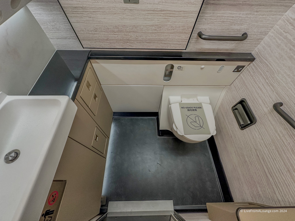 a bathroom with a toilet and sink