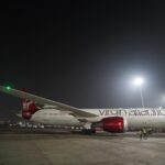 a large airplane on a runway at night