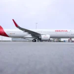 a large white airplane on a runway