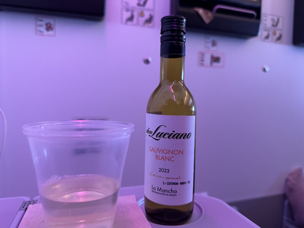 a bottle of wine and a glass of liquid