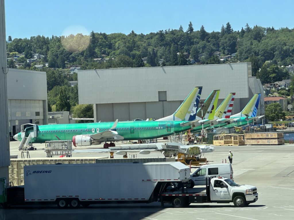 a group of airplanes parked in a hangar