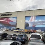 a large building with a large airplane painted on the side