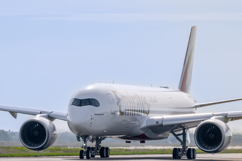 a large white airplane on a runway