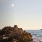 a large rock on the beach