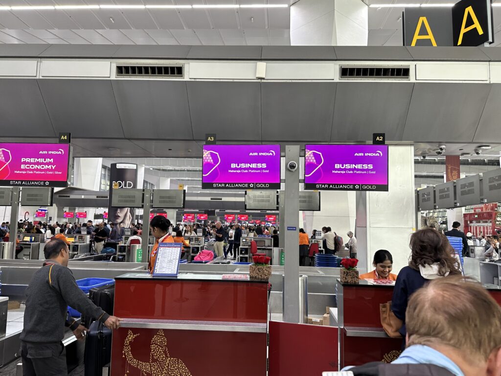 people at the counter of an airport