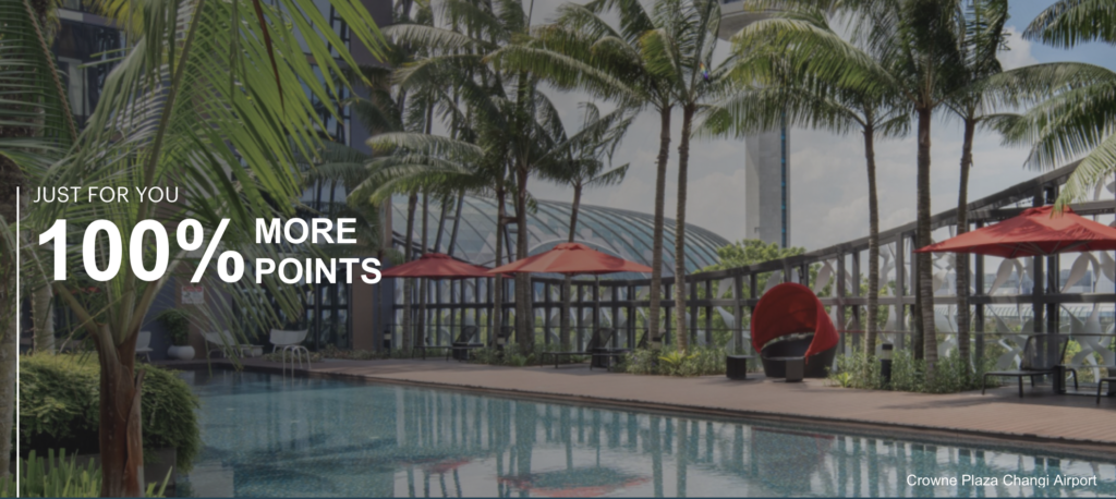 a pool with palm trees and umbrellas