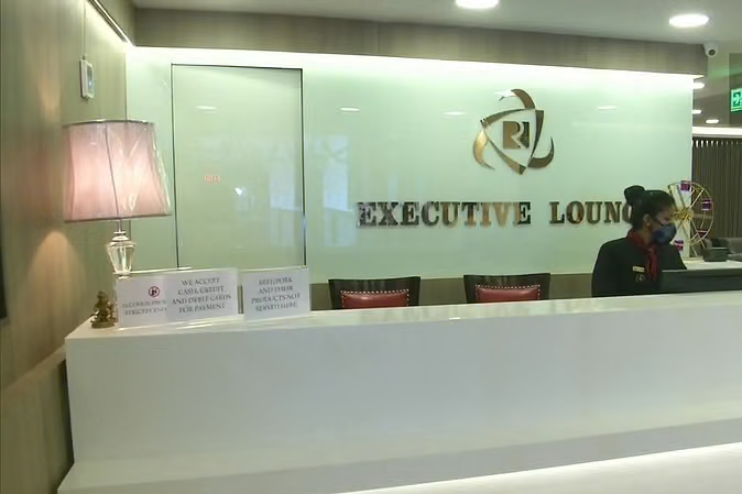 a man sitting at a reception desk