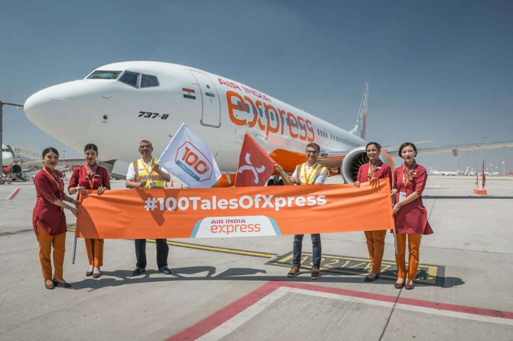 a group of people holding a banner and a plane