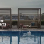The image shows a rooftop swimming pool surrounded by lounge chairs and cabanas. The pool area is on a high-rise building with a cityscape in the background. There is text on the image that reads "Flash Sale 100% More Points." The location is identified as the InterContinental San Antonio Riverwalk.