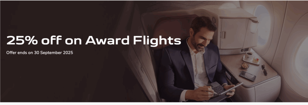 A man in a suit is sitting in an airplane seat, using a tablet. Next to him is a table with a cup of coffee, a dessert, a bowl of nuts, sunglasses, and a smartphone. The text on the left side of the image reads "25% off on Award Flights" with a note that the offer ends on 30 September 2025.