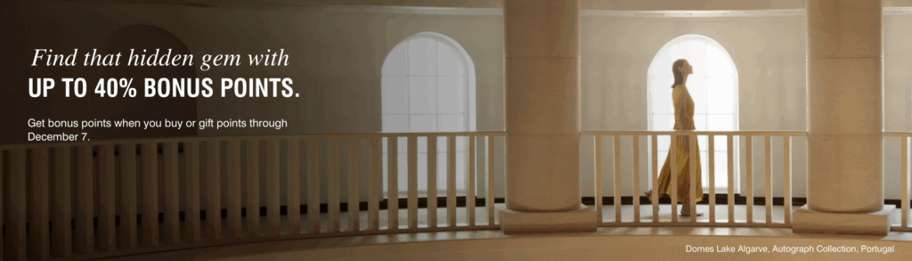 The image shows a person in a yellow dress walking along a balcony with white railings and large columns. There are arched windows in the background. Text on the left side reads: "Find that hidden gem with up to 40% bonus points. Get bonus points when you buy or gift points through December 7." The bottom right corner mentions "Domes Lake Algarve, Autograph Collection, Portugal."