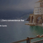 The image is an advertisement for the "Namaste World Sale" by SBI Card. It features a woman in a white dress and straw hat looking at a scenic coastal town with colorful buildings and arches. The text on the left side of the image offers up to 20% off, one free date change, and zero convenience fee. Additional discounts are available with SBI Credit Cards, and the booking period is from 1st to 5th February 2026. Terms and conditions apply.