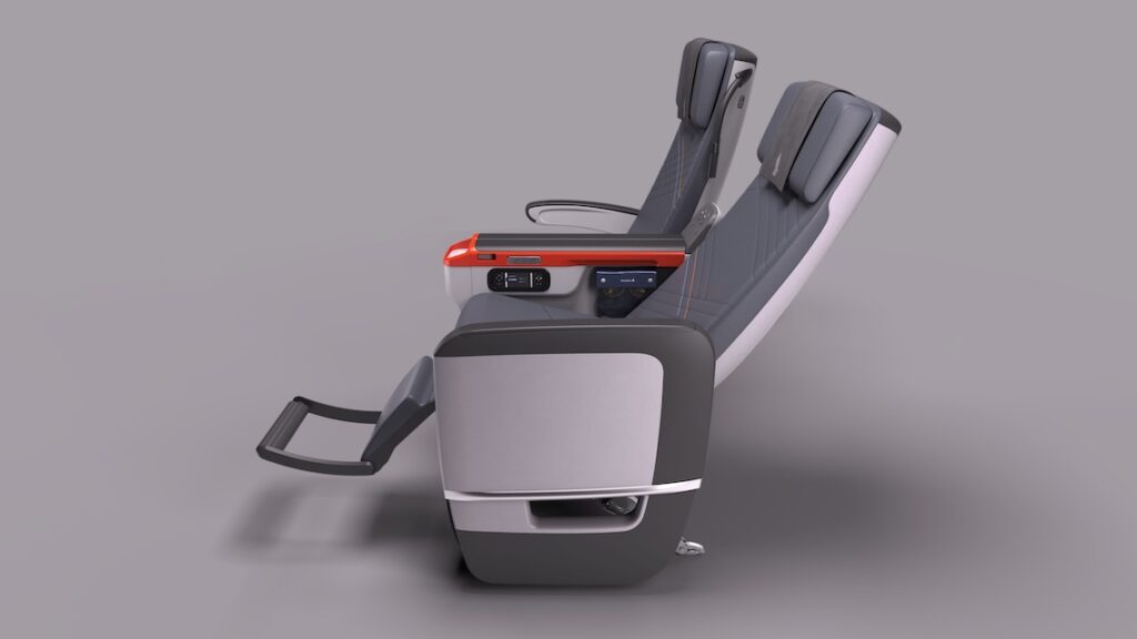 The image shows a side view of two modern airplane seats in a reclined position. The seats have a sleek design with dark upholstery and integrated headrests. The armrests feature built-in controls and a small screen. The seats are positioned on a light gray background.
