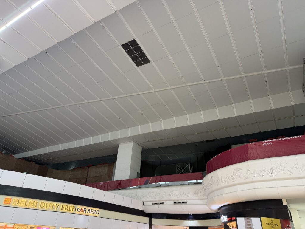 a white ceiling with a red cover
