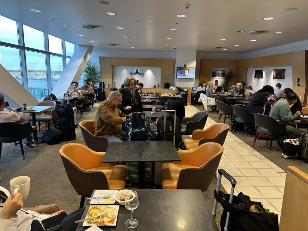 people sitting at tables in a restaurant