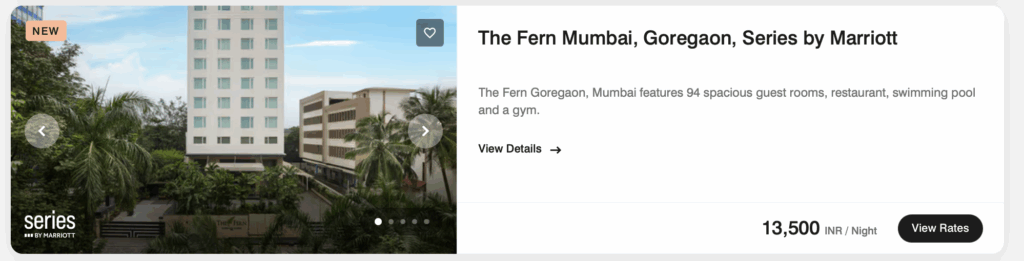 The image shows a promotional display for The Fern Mumbai, Goregaon, Series by Marriott. It features a tall hotel building surrounded by palm trees. The text on the right describes the hotel as having 94 spacious guest rooms, a restaurant, a swimming pool, and a gym. The price is listed as 13,500 INR per night, with an option to view rates. There are navigation arrows and a "NEW" label at the top left.