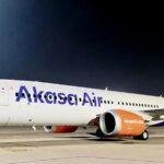 a large white airplane on a runway