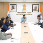 a group of men sitting at a table